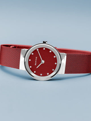 Angle shot of Bering 10126-303 Red Dial Stainless Steel Womens Watch on white background