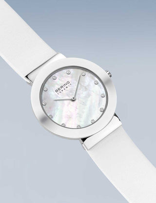 Angle shot of Bering 11435-604 Mother Of Pearl Dial White Leather Womens Watch on white background