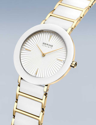 Angle shot of Bering 11435-758 White Dial Gold Stainless Steel Womens Watch on white background