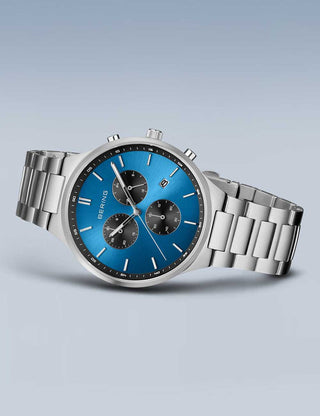 Angle shot of Bering Chronograph 11743-707 Blue Dial Silver Titanium Unisex Watch on white background