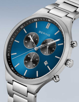 Angle shot of Bering Chronograph 11743-707 Blue Dial Silver Titanium Unisex Watch on white background