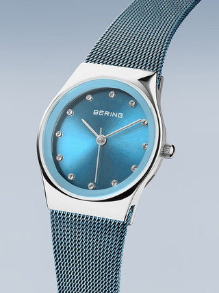 Angle shot of Bering 12927-308 Blue Stainless Steel Womens Watch on white background