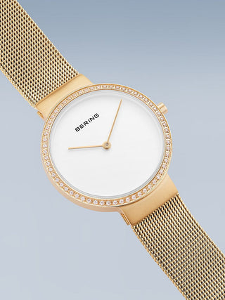 Angle shot of Bering 14531-330 White Dial Gold Stainless Steel Womens Watch on white background