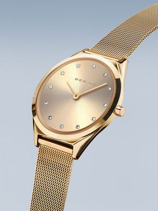 Angle shot of Bering 17031-333 Gold Stainless Steel Womens Watch on white background
