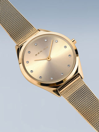 Angle shot of Bering 17031-333 Gold Stainless Steel Womens Watch on white background