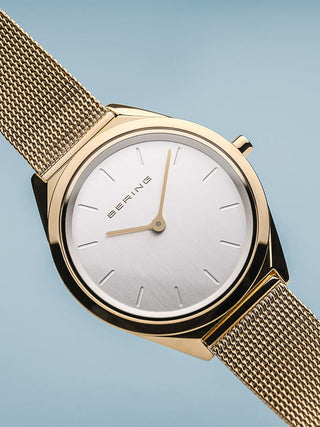 Angle shot of Bering 17031-334 Silver Dial Gold Stainless Steel Womens Watch on white background