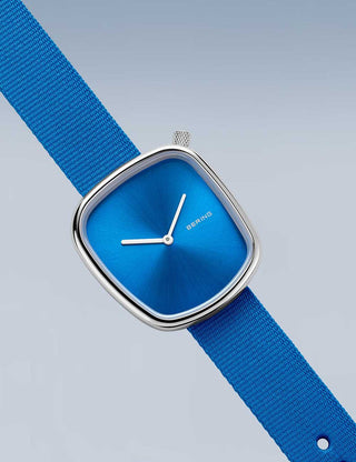 Angle shot of Bering 18034-308 Blue Textile Womens Watch on white background