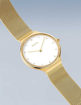 Angle shot of Bering 18434-334 White Dial Gold Stainless Steel Womens Watch on white background