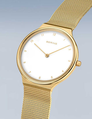 Angle shot of Bering 18434-334 White Dial Gold Stainless Steel Womens Watch on white background