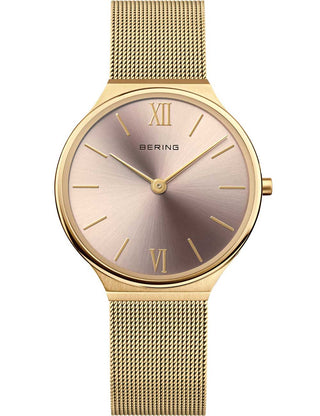 Front view of Bering 18434-336 Pink Dial Gold Stainless Steel Womens Watch on white background