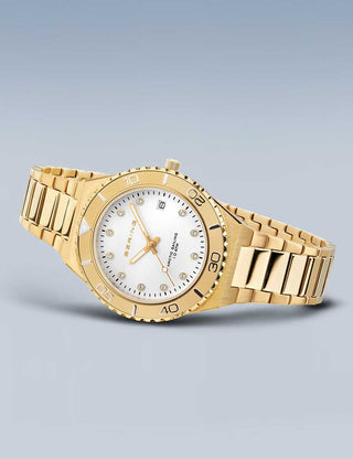 Angle shot of Bering 18936-734 White Dial Gold Stainless Steel Womens Watch on white background