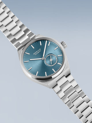 Angle shot of Bering 19435-CHARITY Blue Dial Silver Stainless Steel Womens Watch on white background