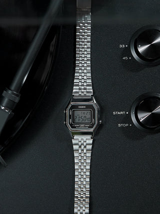 Angle shot of Casio LA680WEA-1EF Black Dial Silver Stainless Steel Unisex Watch on white background