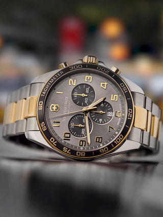 Angle shot of Victorinox Chronograph 241902 Grey Dial Gold Stainless Steel Unisex Watch on white background