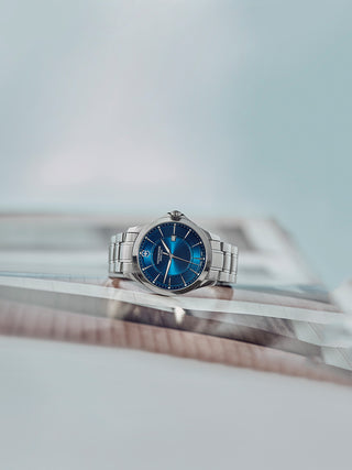 Angle shot of Victorinox 241910.1 Blue Dial Silver Stainless Steel Unisex Watch on white background