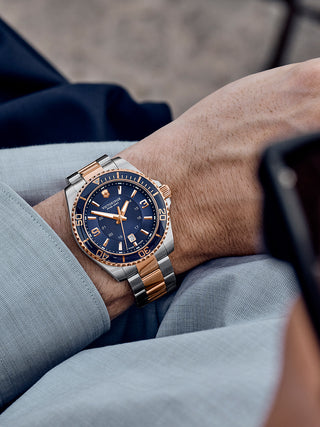 Angle shot of Victorinox 241950 Blue Dial Rose Gold Stainless Steel Unisex Watch on white background