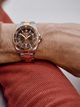 Angle shot of Victorinox 241951 Brown Dial Rose Gold Stainless Steel Unisex Watch on white background