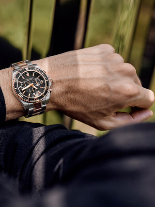 Angle shot of Victorinox Chronograph 241952 Black Dial Rose Gold Stainless Steel Unisex Watch on white background