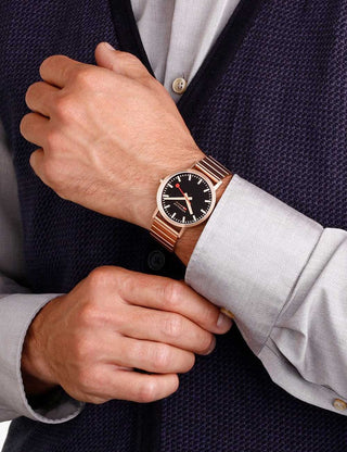 Angle shot of Mondaine A660.30360.16SBR Black Dial Rose Gold Stainless Steel Unisex Watch on white background