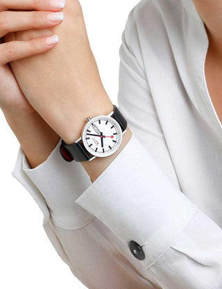 Angle shot of Mondaine A667.30314.11SBBV White Dial Black Leather Unisex Watch on white background