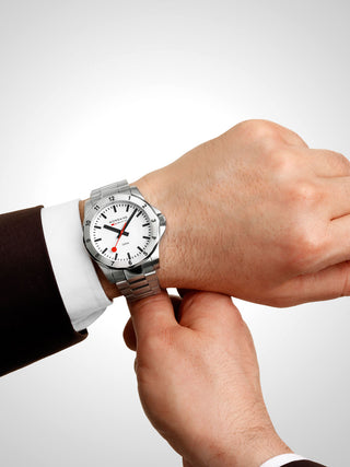 Angle shot of Mondaine MSN.4211B.SK White Dial Silver Stainless Steel Unisex Watch on white background
