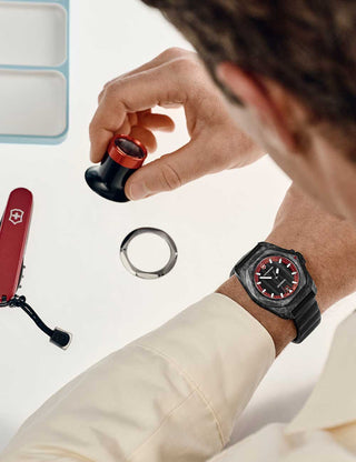 Angle shot of Victorinox 242024.1 Red Dial Black Strap Unisex Watch on white background