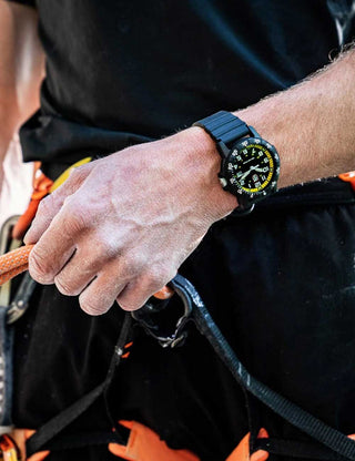 Angle shot of Luminox XS.0325 Yellow Dial Black Silicone Unisex Watch on white background