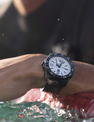 Angle shot of Luminox XS.3127M White Dial Black Strap Unisex Watch on white background